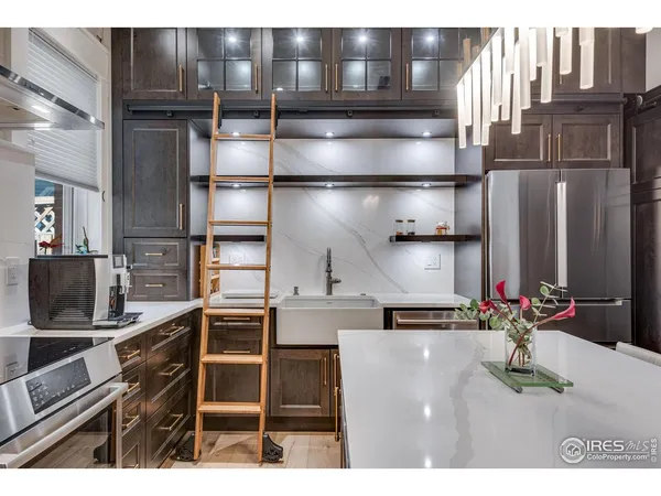 a kitchen with a sink and a stove