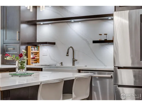 a kitchen with kitchen island a counter top and stove
