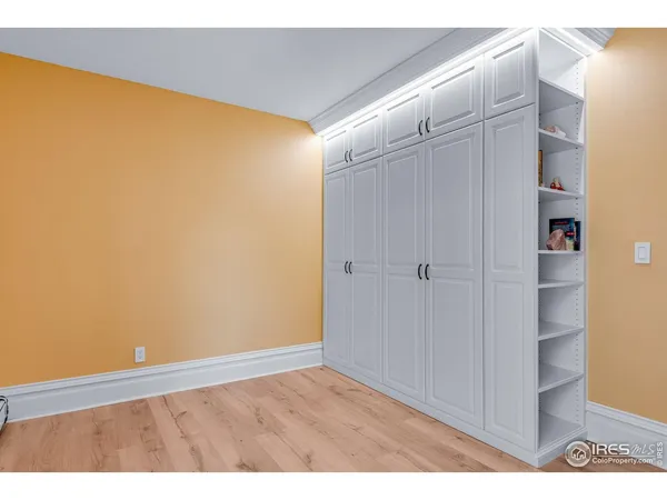 a bathroom with a sink a toilet a mirror and shower