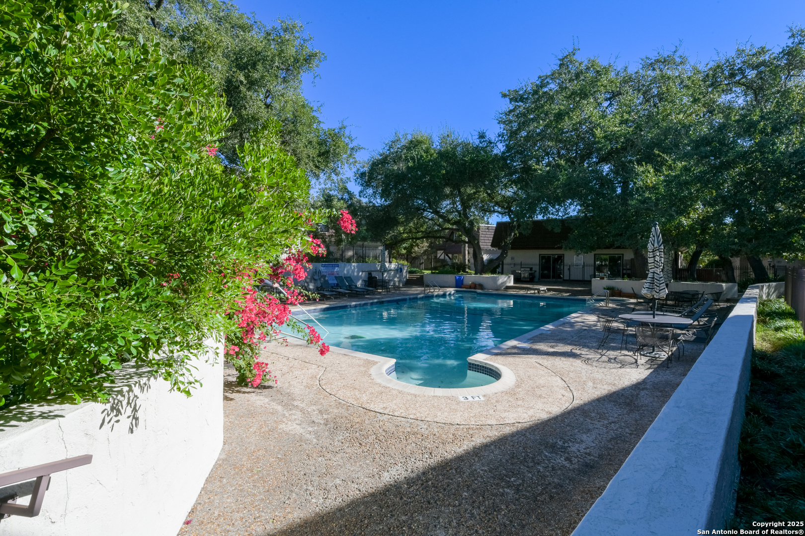 8715 Starcrest, Unit 58 San Antonio, TX 78217 - Photo 1 of 30 a view of a swimming pool with a sitting area