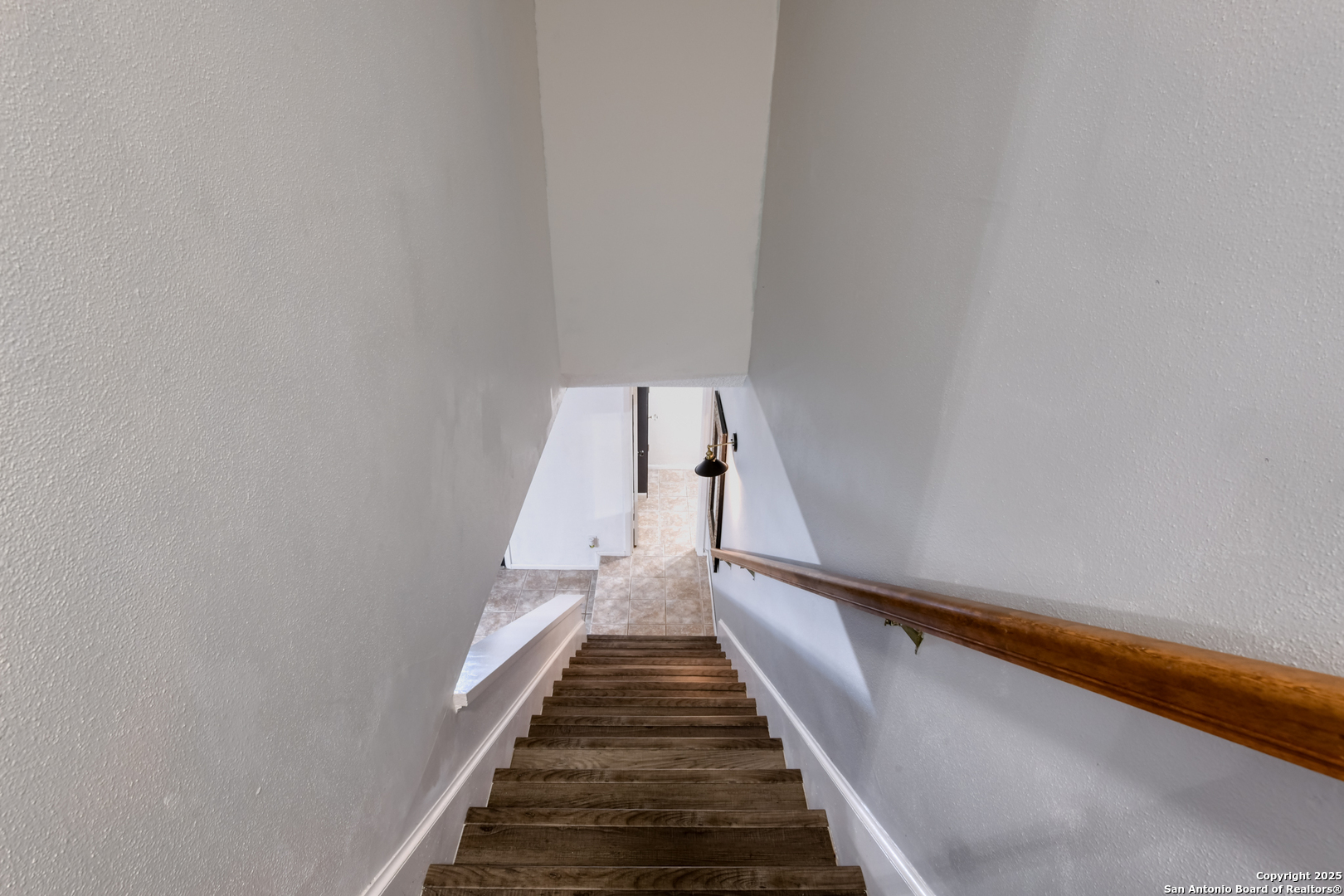 8715 Starcrest, Unit 58 San Antonio, TX 78217 - Photo 11 of 30 a view of a hallway with wooden floor