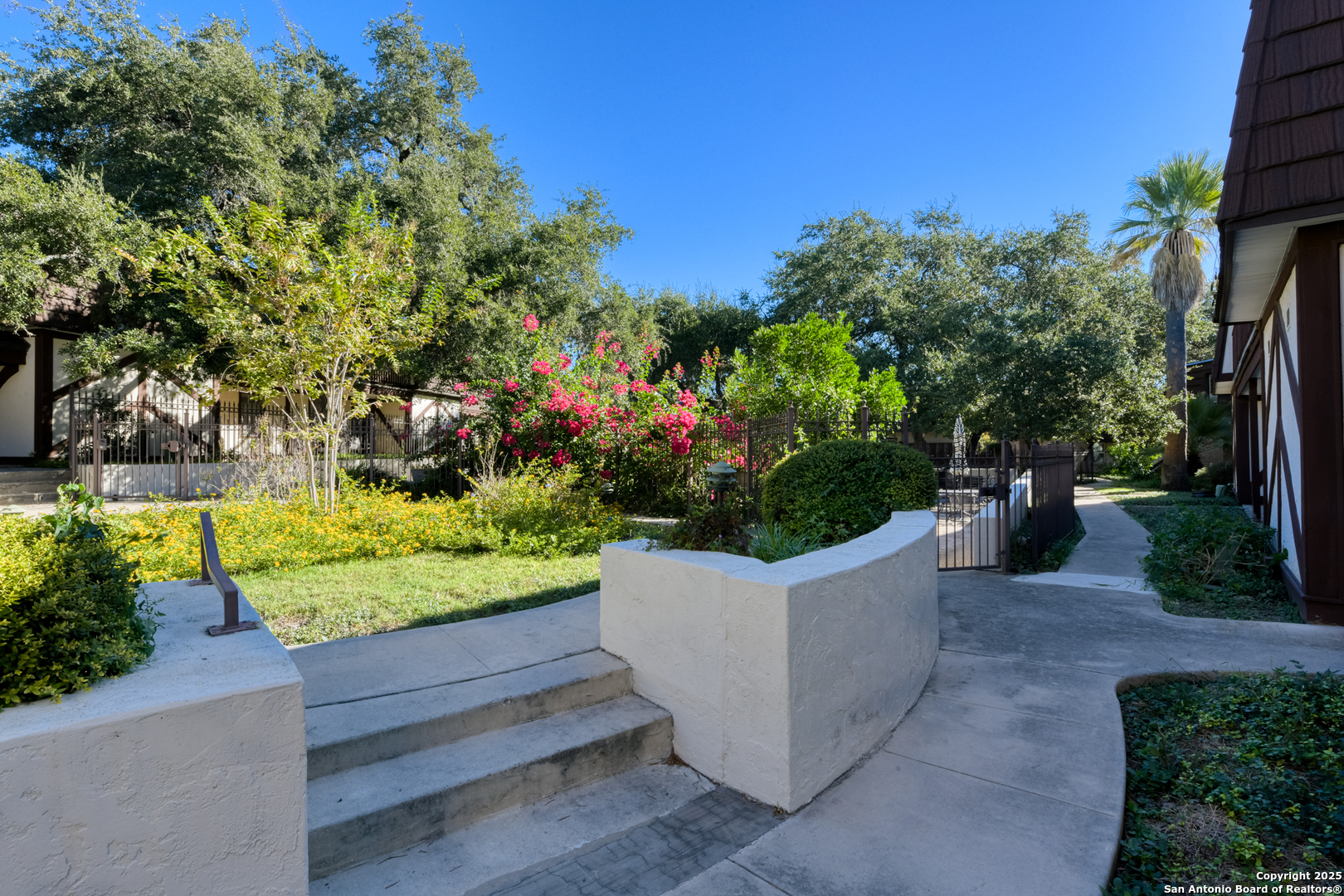 8715 Starcrest, Unit 58 San Antonio, TX 78217 - Photo 18 of 30 a view of a bench in a garden