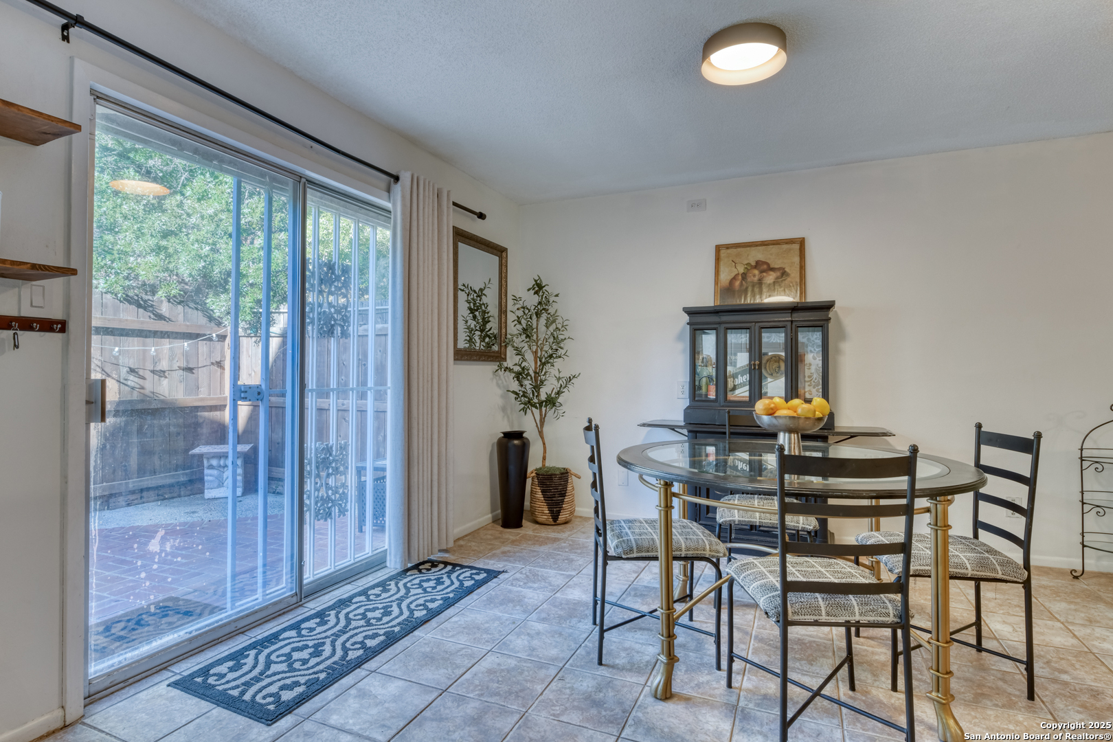 8715 Starcrest, Unit 58 San Antonio, TX 78217 - Photo 22 of 30 a dining room with furniture and window