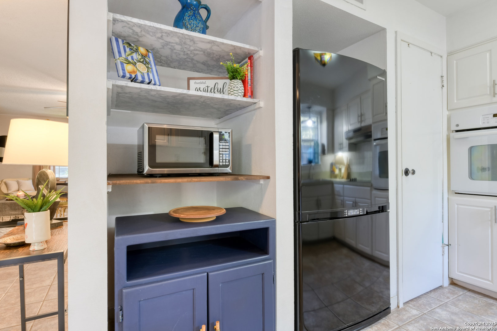 8715 Starcrest, Unit 58 San Antonio, TX 78217 - Photo 23 of 30 a bathroom with a sink and a mirror