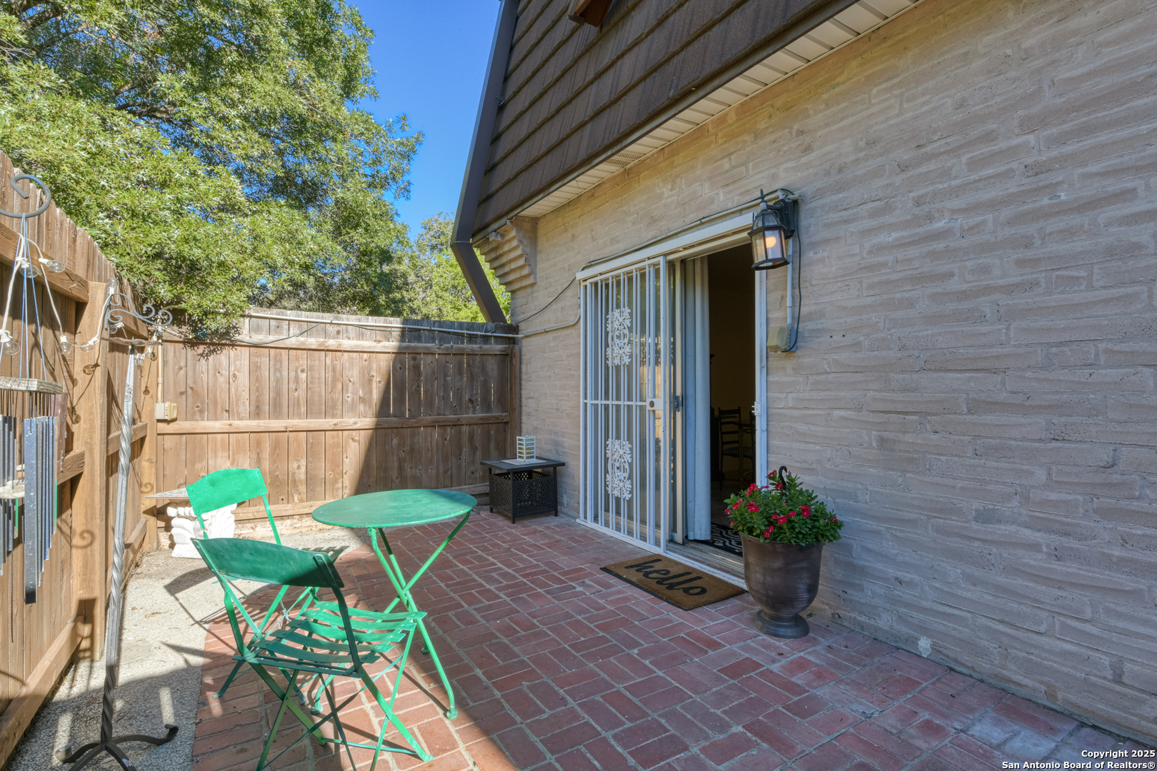 8715 Starcrest, Unit 58 San Antonio, TX 78217 - Photo 30 of 30 a view of a chair and table in backyard of the house