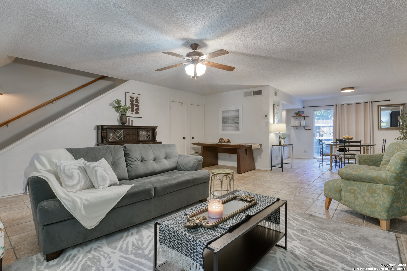 8715 Starcrest, Unit 58 San Antonio, TX 78217 - Photo 4 of 30 a living room with furniture and wooden floor