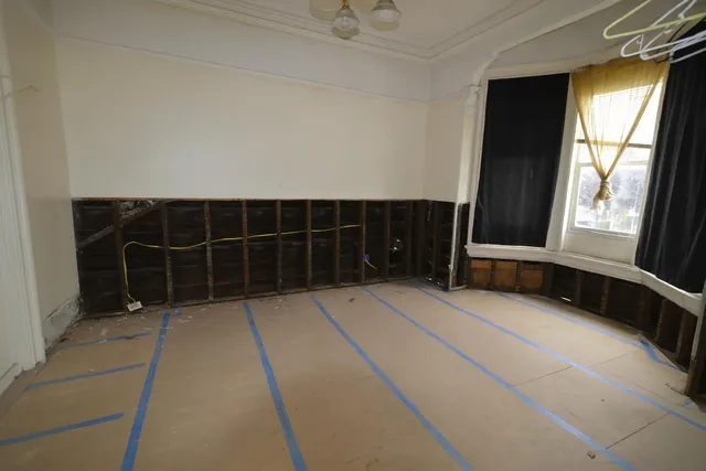 a view of an empty room with a window