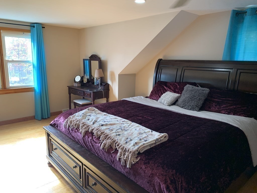 63 Lowell Road Pepperell, MA 01463 - Photo 11 of 32 a bedroom with a bed and window