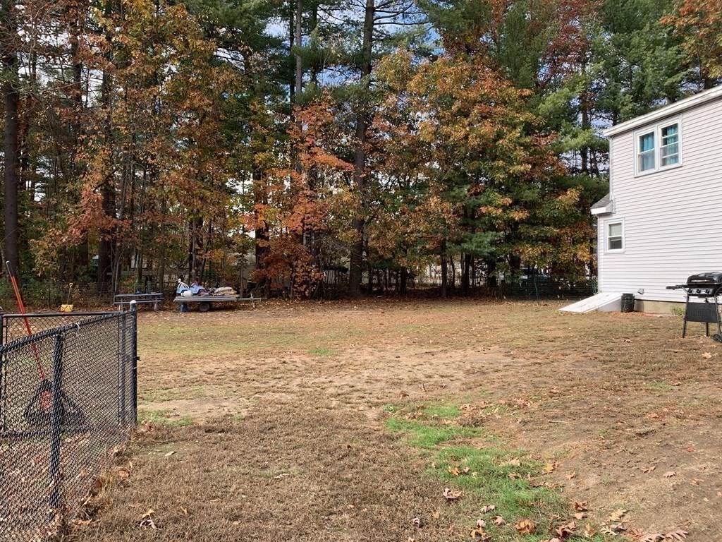 63 Lowell Road Pepperell, MA 01463 - Photo 23 of 32 a view of an outdoor space and a yard
