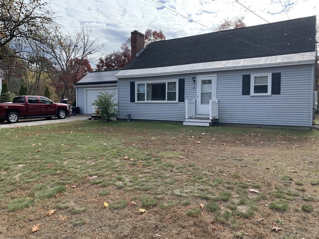 63 Lowell Road Pepperell, MA 01463 - Photo 4 of 32 a view of a house with a garden