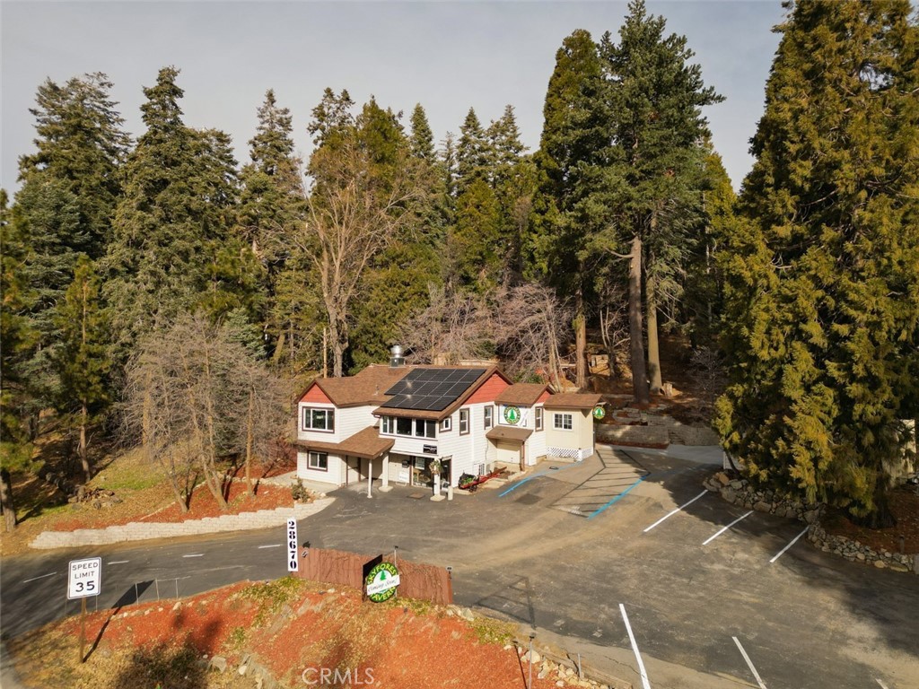 28670 Highway 18 Lake Arrowhead, CA 92385 - Photo 1 of 24 a view of a patio with table and chairs with wooden fence