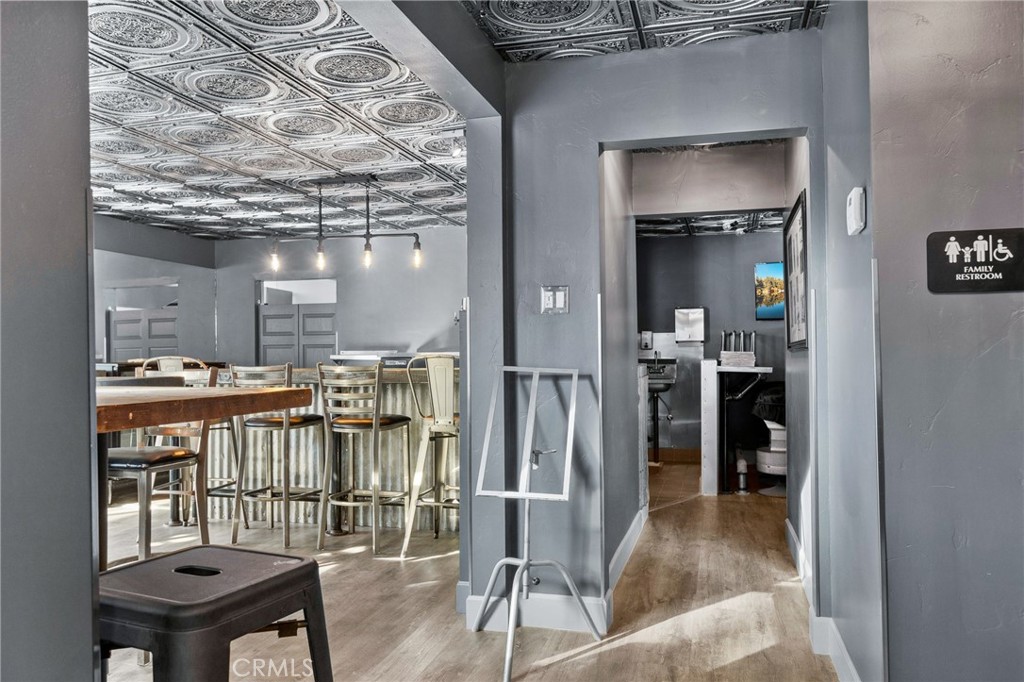 28670 Highway 18 Lake Arrowhead, CA 92385 - Photo 11 of 24 a view of a livingroom kitchen and dining room with wooden floor