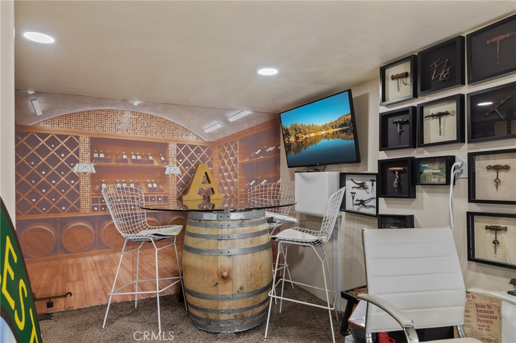 28670 Highway 18 Lake Arrowhead, CA 92385 - Photo 20 of 24 a living room with furniture and a flat screen tv
