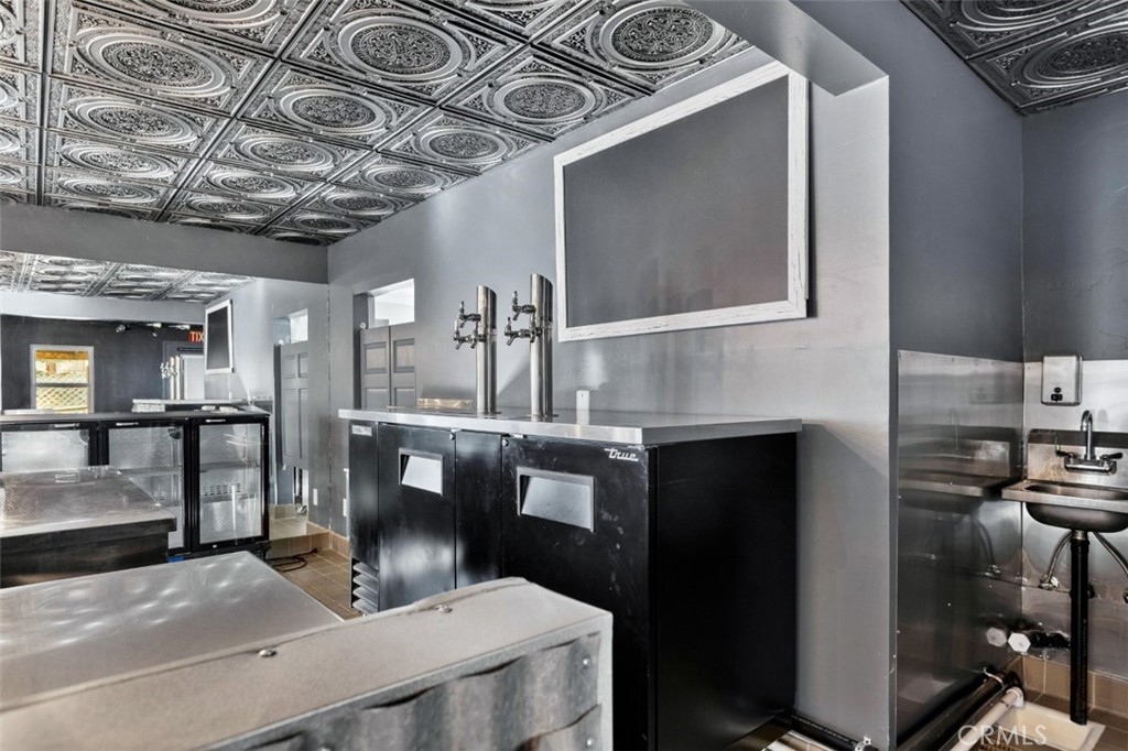 28670 Highway 18 Lake Arrowhead, CA 92385 - Photo 8 of 24 a kitchen with a stove a microwave and white cabinets