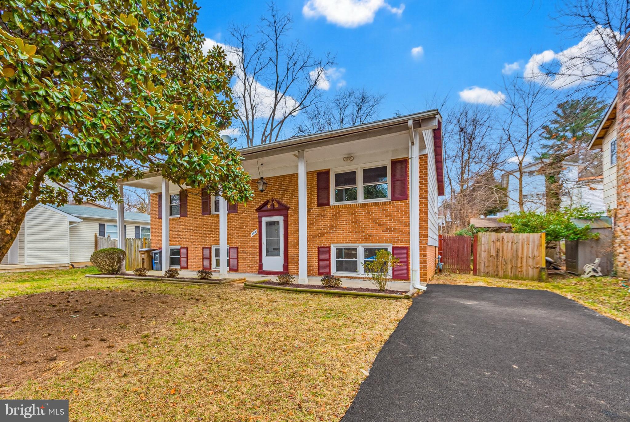 404 Ritchie Parkway Rockville, MD 20852 - Photo 1 of 38 a front view of a house with a yard