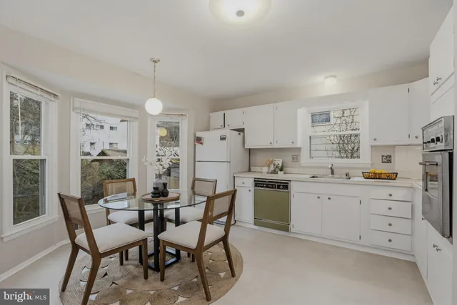 a kitchen with appliances and cabinets