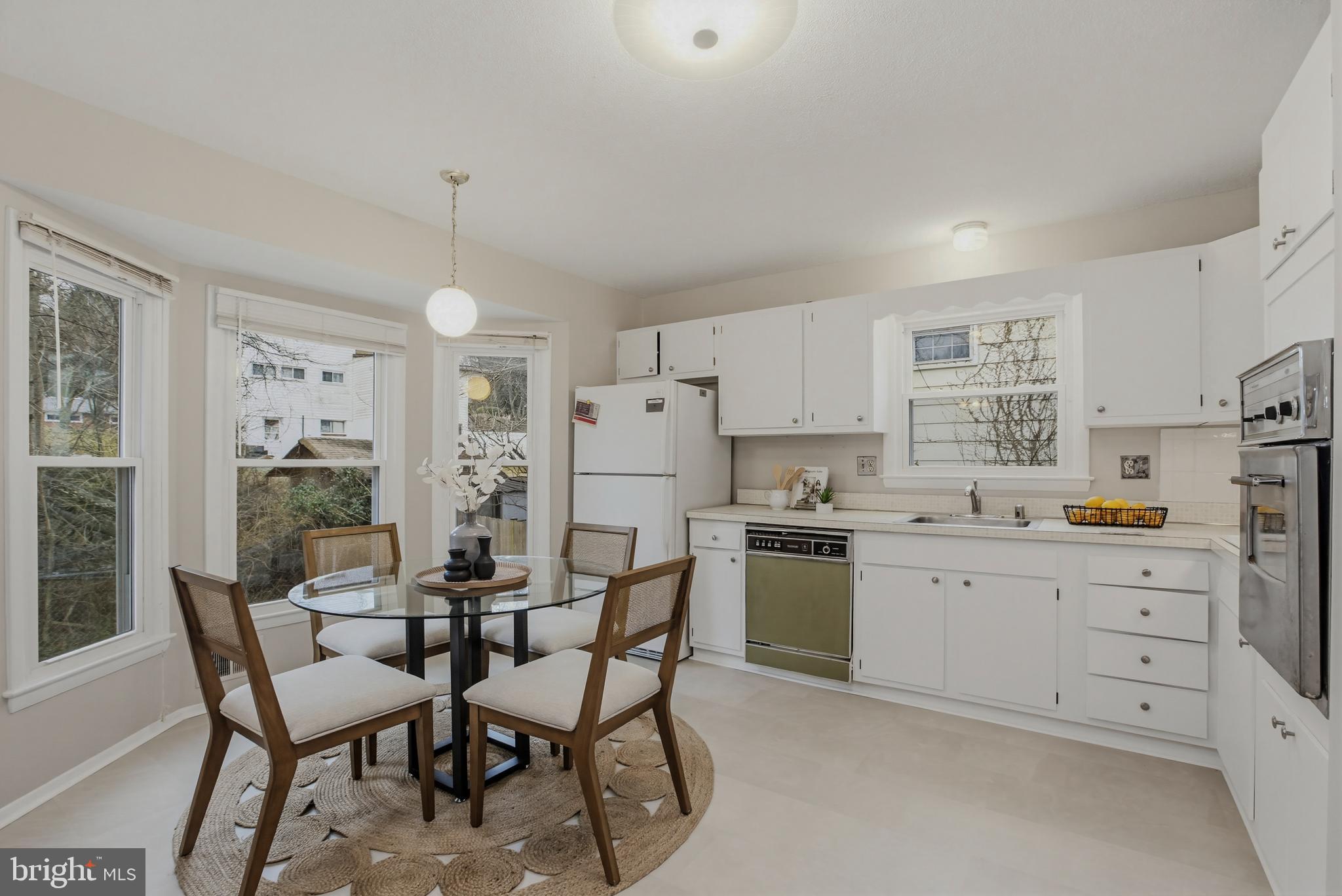 404 Ritchie Parkway Rockville, MD 20852 - Photo 12 of 38 a kitchen with appliances and cabinets