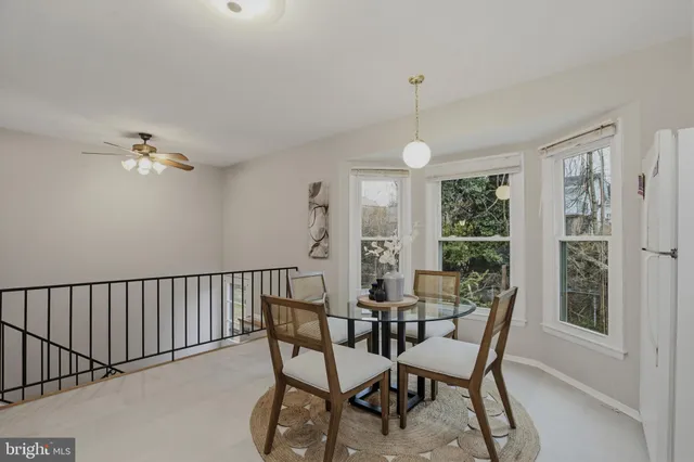 a view of a dining room with furniture and window