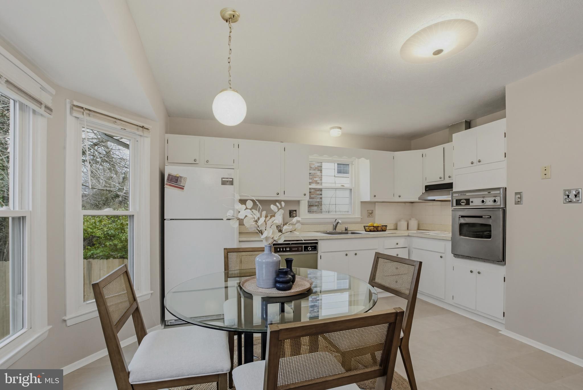 404 Ritchie Parkway Rockville, MD 20852 - Photo 14 of 38 a view of a dining room with furniture window and wooden floor