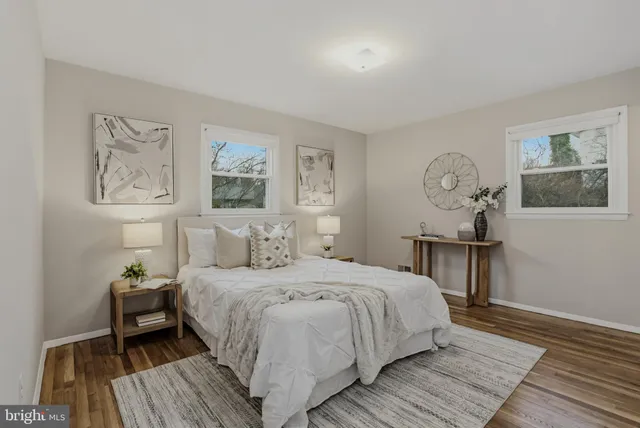 a bedroom with a bed and a table