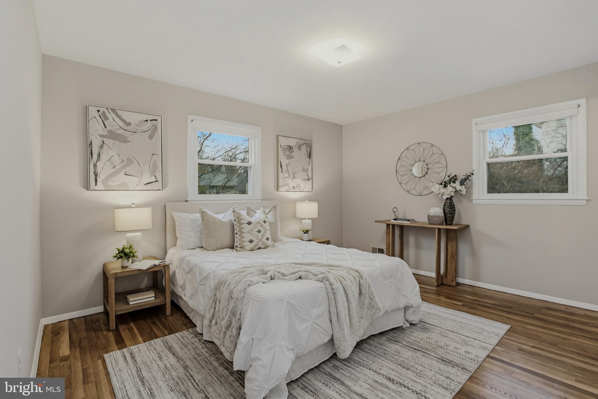 404 Ritchie Parkway Rockville, MD 20852 - Photo 15 of 38 a bedroom with a bed and a table