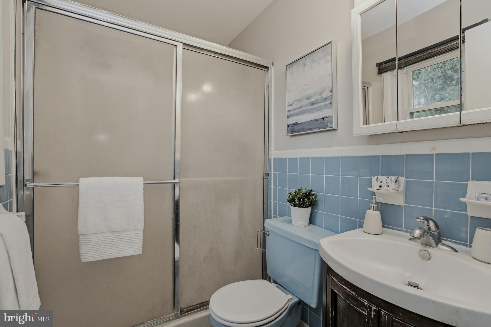 404 Ritchie Parkway Rockville, MD 20852 - Photo 18 of 38 a bathroom with a sink toilet and shower