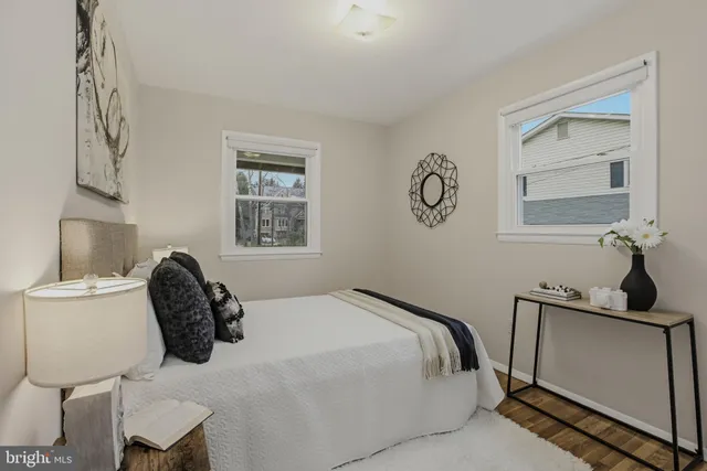 a bedroom with a bed and chair