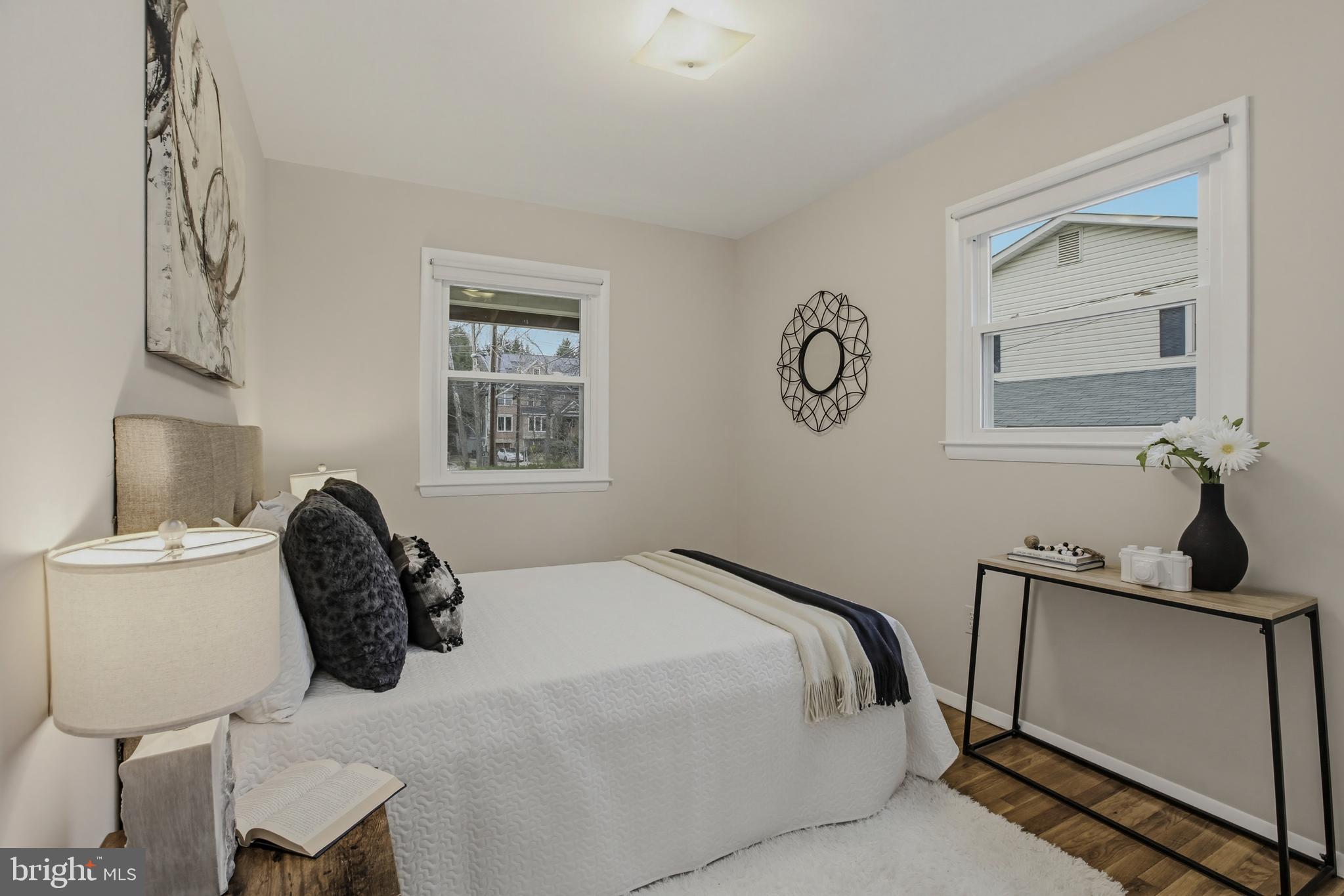 404 Ritchie Parkway Rockville, MD 20852 - Photo 19 of 38 a bedroom with a bed and chair