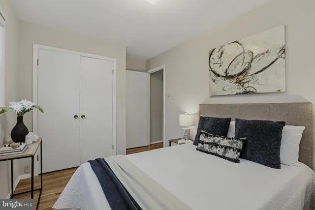 a bedroom with a bed and cabinets