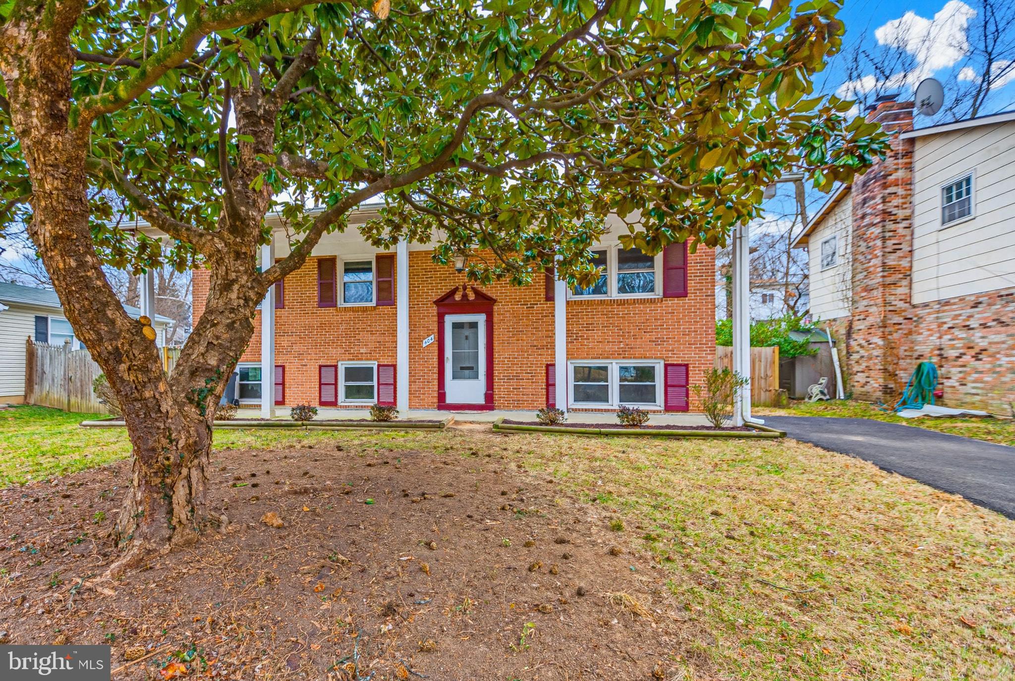 404 Ritchie Parkway Rockville, MD 20852 - Photo 2 of 38 a front view of a house with a yard