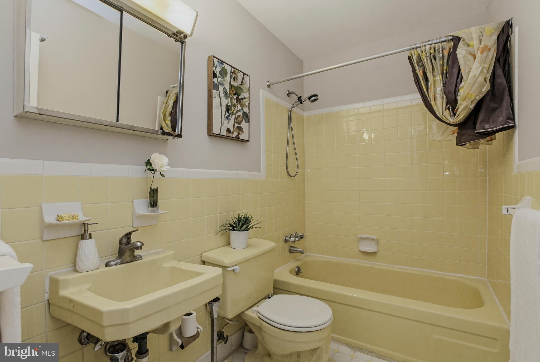 404 Ritchie Parkway Rockville, MD 20852 - Photo 22 of 38 a bathroom with a sink toilet and shower