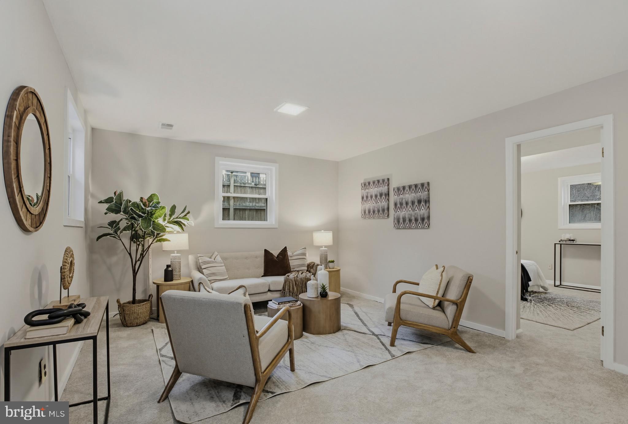 404 Ritchie Parkway Rockville, MD 20852 - Photo 26 of 38 a living room with furniture a chandelier and a window