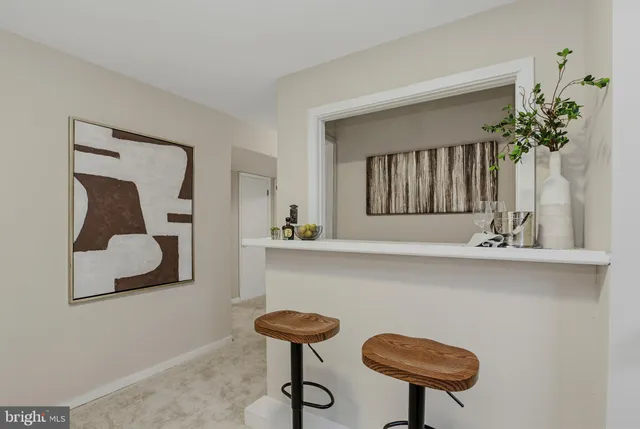 a bedroom with a bed and a lamp on table