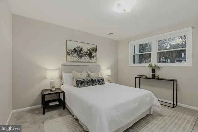 a bedroom with a bed and a couch