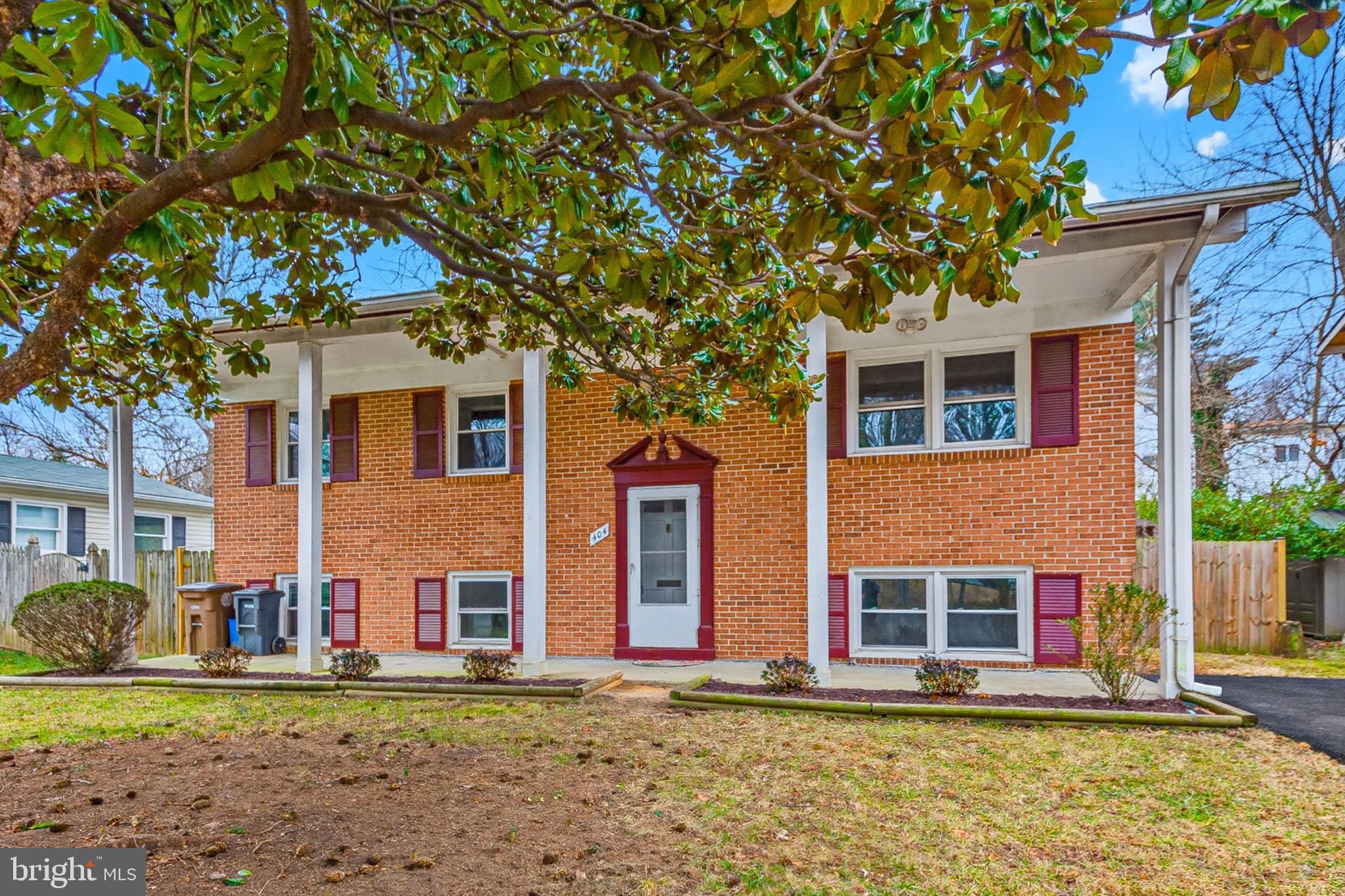 404 Ritchie Parkway Rockville, MD 20852 - Photo 5 of 38 a front view of a house with a yard