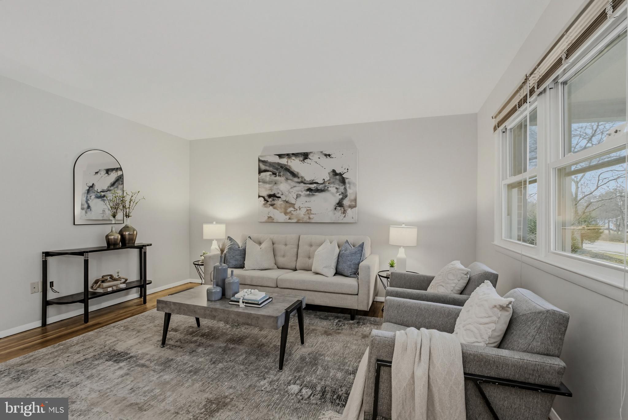 404 Ritchie Parkway Rockville, MD 20852 - Photo 8 of 38 a living room with furniture a rug and a large window
