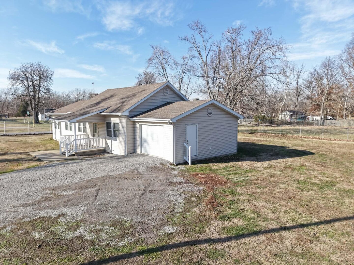 190 Public Street Muddy, IL 62965 - Photo 13 of 16 a front view of a house with a yard and garage
