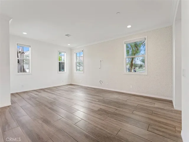 a white toilet sitting next to a bath tub and a shower