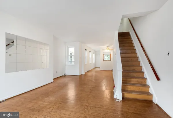 a view of an entryway with wooden floor