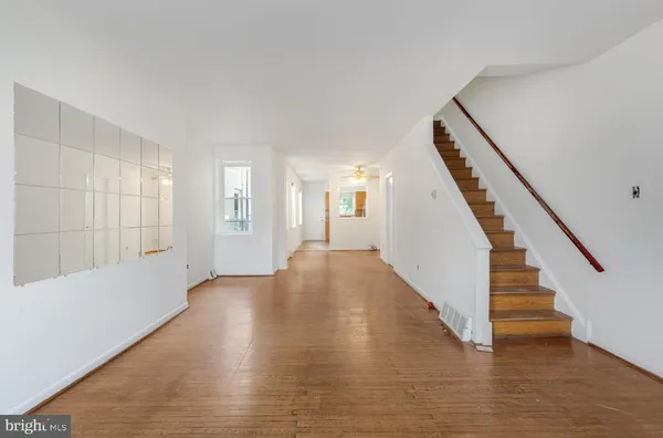 a view of an entryway with wooden floor