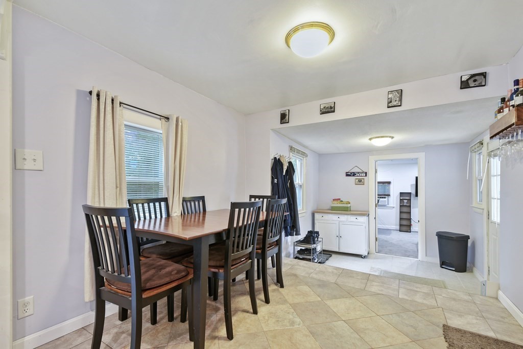 22 Ox Road Billerica, MA 01821 - Photo 11 of 26 a view of a dining room with furniture and a chandelier