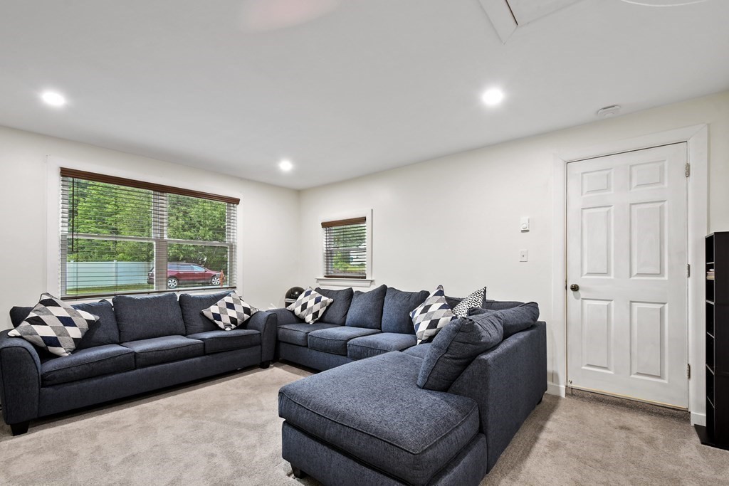 22 Ox Road Billerica, MA 01821 - Photo 14 of 26 a living room with furniture and a large window