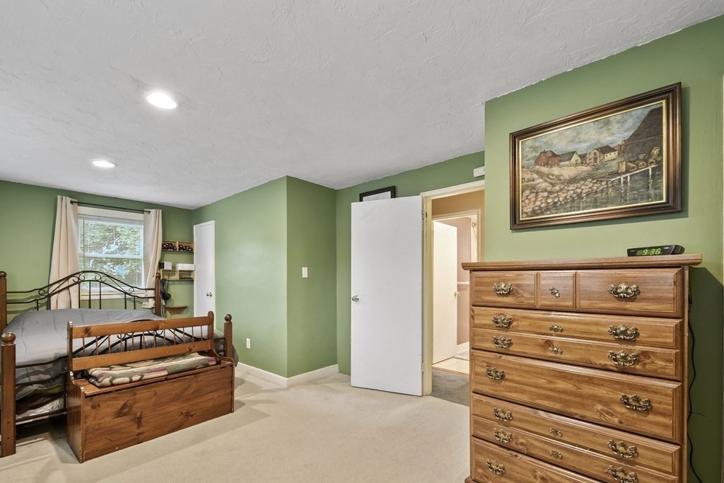22 Ox Road Billerica, MA 01821 - Photo 17 of 26 a bedroom with a bed and a dresser