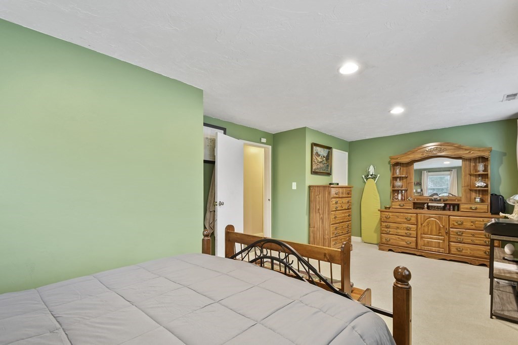 22 Ox Road Billerica, MA 01821 - Photo 18 of 26 a bedroom with a bed and a large window