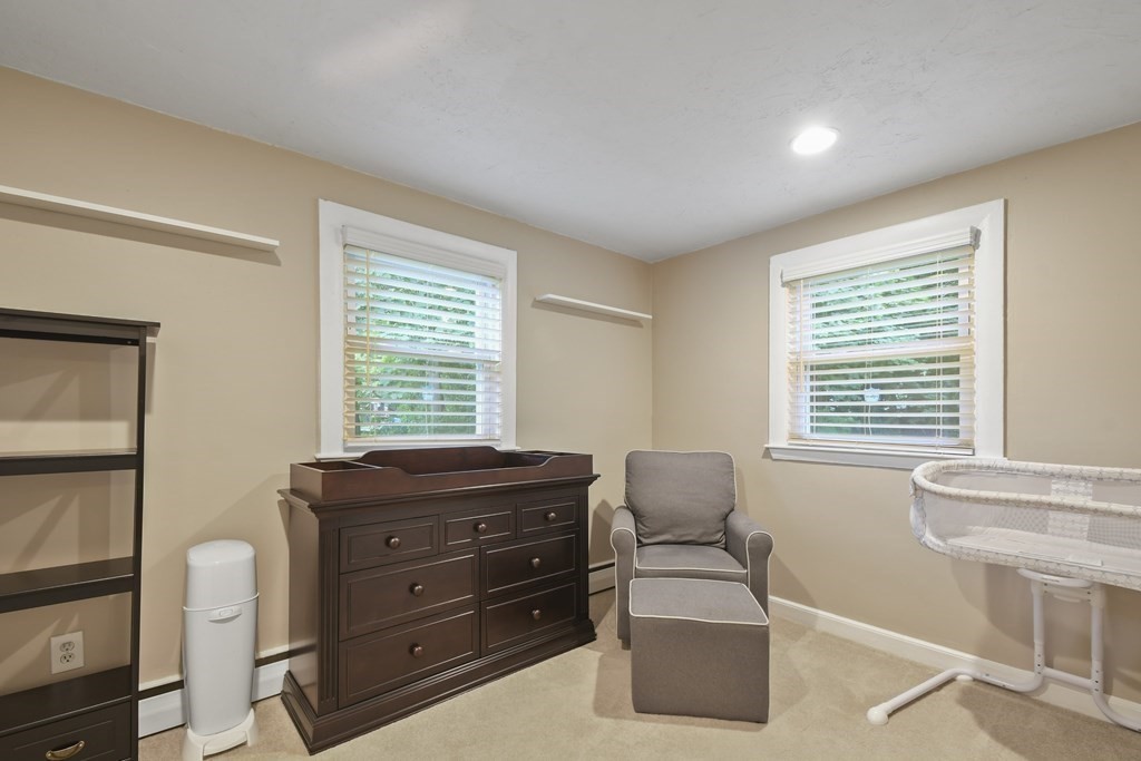 22 Ox Road Billerica, MA 01821 - Photo 20 of 26 a room with a couch and a window