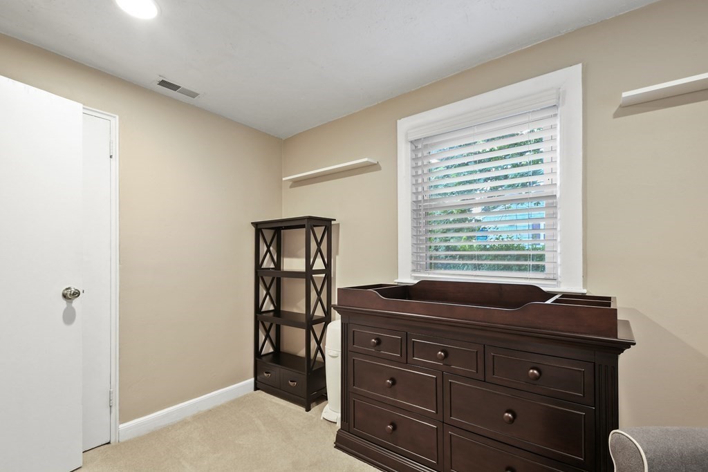 22 Ox Road Billerica, MA 01821 - Photo 21 of 26 a room with a dresser and a window