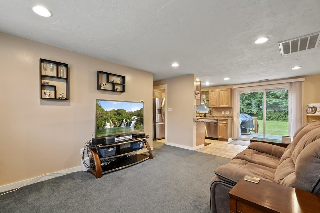 22 Ox Road Billerica, MA 01821 - Photo 6 of 26 a living room with furniture gym equipment and a large window