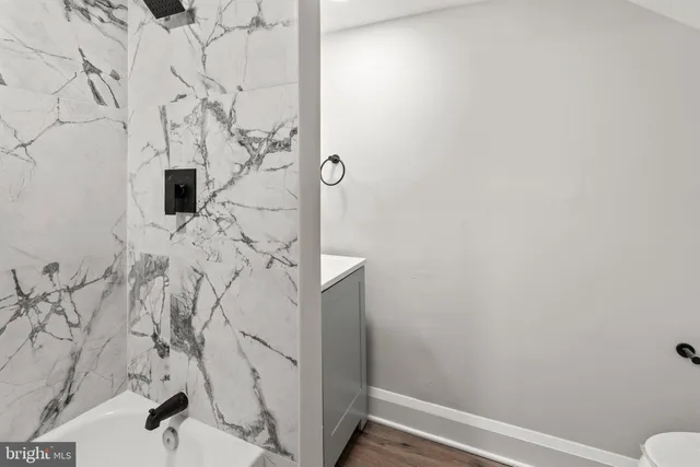 a bathroom with a sink and vanity