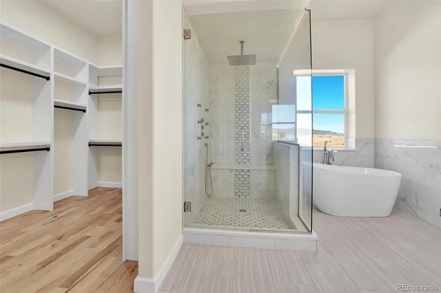 a white bath tub sitting in a bathroom