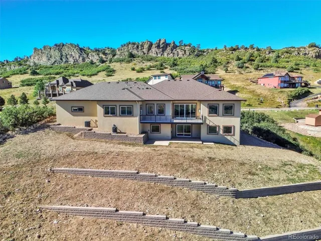 a hallway with white cabinets and sink